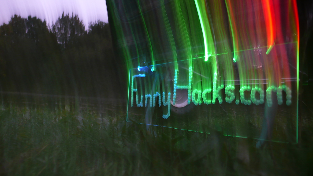 Playing with the sign, exposure times, and movement. Blue, green, red.