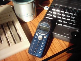 Phone on the desk running on AA batteries.